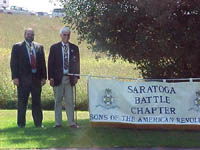 Past Chapter President Rick Saunders and Chapter President Duane Booth pose with the Chapter's banner.
