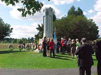 The gathering pauses after the ceremony to reflect on the event and the beautiful day.