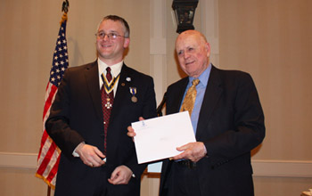 Richard C. Saunders, III* and President Fullam *Dick Saunders accepted for his grandson Richie who is the son of Rick and Lyn Saunders - Photo: Rick Saunders