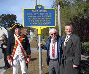 (l-r) Chapter Treasurer Mike Companion, Past Chapter President Duane Booth and Chapter President Rich Fullam with historic signage marker donated by the Chapter and dedicated Friday, October 16. 2009.  The sign is located at the entrance to Fort Hardy Park on NY Route 29 in the Village of Schuylerville. - Photo courtesy of Duane Booth