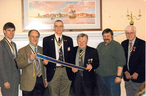 The streamer which is added to our Chapter's SAR Flag was awarded by the National Society for the $1,000.00 donation voted on at our September 2012 meeting for the National Society's Center For America's Heritage.  Pictured (l-r): Jonathan Goebel, Society President Richard Sage, Peter Goebel, Thomas Dunne, George Malinoski and Duane Booth - Photo courtesy of Kathleen Gydesen