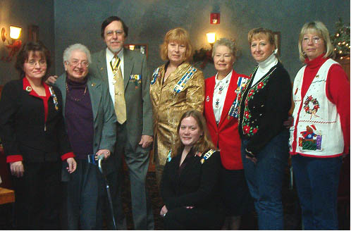 Ms. Rowe was presented with replacements for the SAR Medal of Appreciation and Daughters of Liberty Medal that were among the items stolen from Judy's home this past summer.  Gertrude (Judy) Rowe is second from the left, leaning on the cane.  Dennis Marr is third from left.  Photo courtesy of Regent Kathy Keenan.