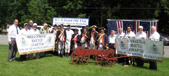 Members of Walloomsac and Saratoga Battle Chapters, SAR, pose with members of the 2nd Continental Artillery - (L-r) Tim Mabee, Pat Festa, Doug Gallant, John Sheaff, Dennis Booth, Jim Hilton, Al Bartlett, Tim Butler, Bret Trufant, Andrew Companion, Pete Hormel, Mike Companion, Brad Allen, Tom Dunne, Harry Booth, Tivo Africa, Duane Booth, Pat Reilly.  The 3 pounder, which was built by Mike Companion, is named 'Cricket'