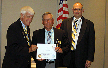 Patrick Festa receiving the Service Pin from ESS President Booth (L) and SBC President Gallant (R)