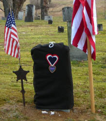 New gravestone before unveiling with a replica of the Badge of Military Merit - Photo by George Ballard