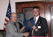 Kurt receives a 30 year service award with Dick and Kay Saunders looking on - Photo by Duane Booth